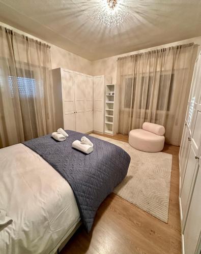 a bedroom with a bed with two towels on it at Gigi's Place in Viareggio