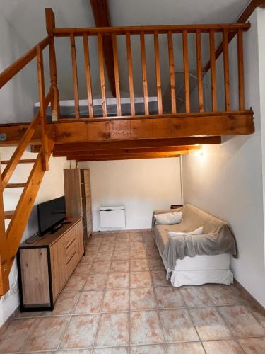 a room with a bunk bed and a staircase at LES VIEUX CABASSOLS VENELLES in Venelles