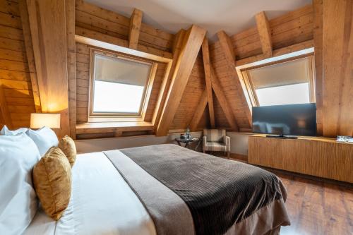 Postel nebo postele na pokoji v ubytování Hotel Val de Neu G.L.