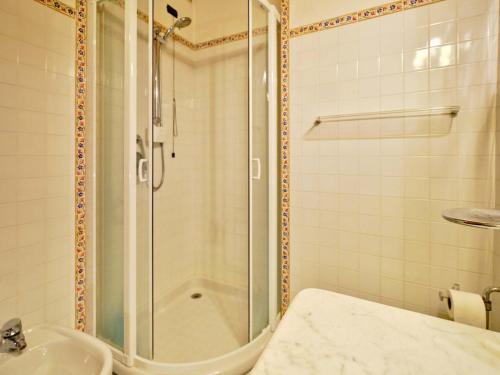 a bathroom with a shower and a sink at Welcome Traveller BERNARDO HOUSE in Garda