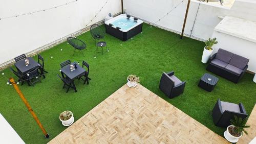 an overhead view of a patio with tables and chairs at Stabile Hospitality in Trapani