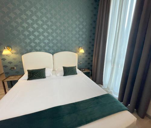 Katil atau katil-katil dalam bilik di Hotel Florence Milano