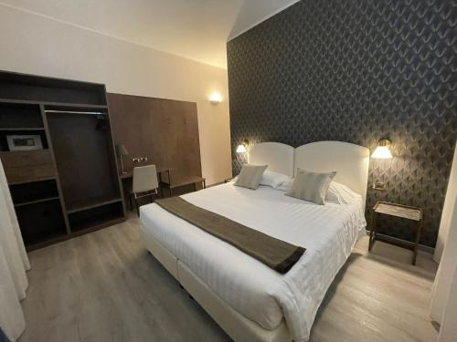 Katil atau katil-katil dalam bilik di Hotel Florence Milano