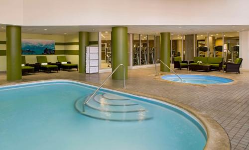 a large swimming pool in a hotel lobby at Hyatt Regency New Brunswick in New Brunswick