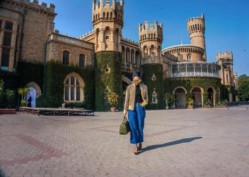 a woman is standing in front of a castle at Hyatt Centric MG Road Bangalore in Bengaluru