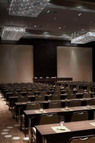 an empty conference room with tables and chairs at Park Hyatt Hotel and Residences, Hyderabad in Hyderabad