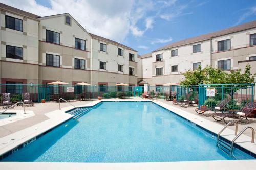 an image of a swimming pool in front of a building at Hyatt House Boston/Burlington in Burlington