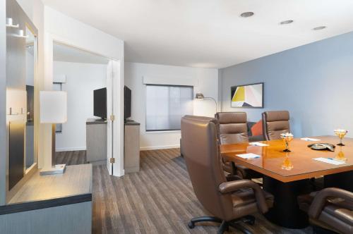 a conference room with a table and chairs at Hyatt House White Plains in White Plains