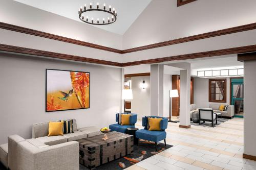 a living room with a couch and chairs at Hyatt House Scottsdale Old Town in Scottsdale