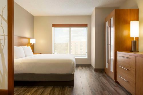 a hotel room with a bed and a window at Hyatt Place Columbia/Downtown/The Vista in Columbia