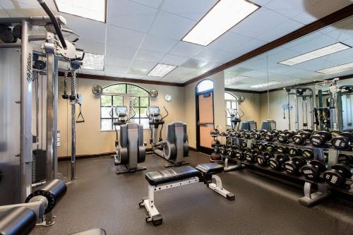 a gym with a row of treadmills and machines at Hyatt House San Ramon in San Ramon