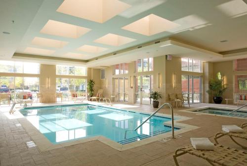 a large swimming pool in a building at Hyatt House Seattle Bellevue in Bellevue