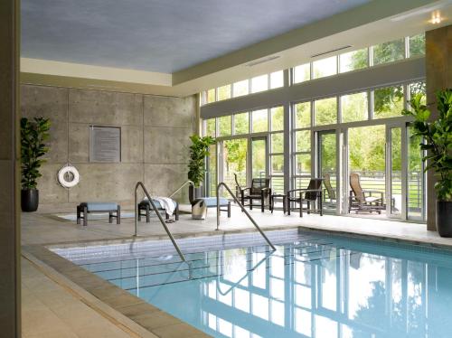 a swimming pool in a house with a large window at Hyatt House Seattle/Redmond in Redmond