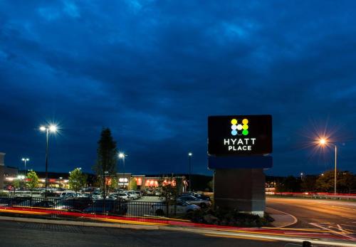 a sign for a hyatt place in a parking lot at Hyatt Place Boston/Braintree in Braintree