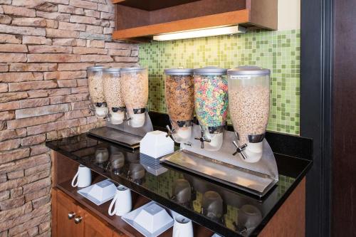 a bunch of glass vases sitting on a counter at Hyatt Place Charleston Airport / Convention Center in Charleston