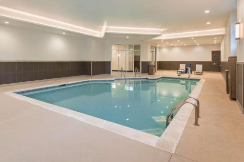 a large swimming pool in a hotel room at Hyatt Place Greenville Downtown in Greenville