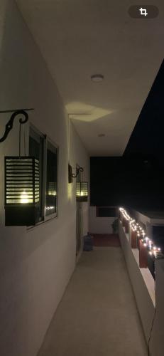a room with a hallway with lights on the wall at Villa Noblezza in Las Lagunas