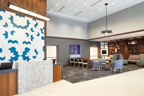 a rendering of a waiting area in a hospital lobby at Hyatt Place Melbourne - Palm Bay - I-95 in Melbourne