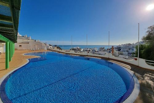a large swimming pool on top of a building at RosaMar apartment sea view and pool in Albufeira