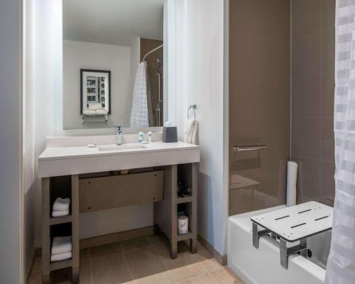 a bathroom with a sink and a shower at Hyatt House Allentown-Lehigh Valley in Allentown