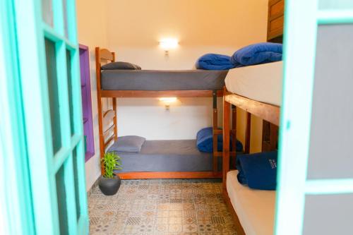 Ένα ή περισσότερα κρεβάτια σε δωμάτιο στο Casa Blanca Hostel