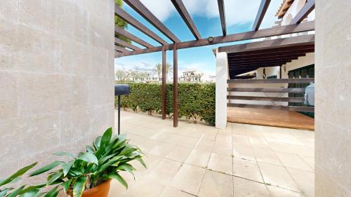 a patio with a view of a building at Orquidea in Perelló