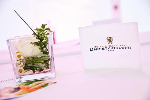 a vase filled with vegetables on top of a table at Hotel & Restaurant Christkindlwirt in Steyr