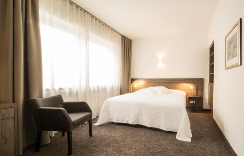 Ένα ή περισσότερα κρεβάτια σε δωμάτιο στο Hotel Friederike