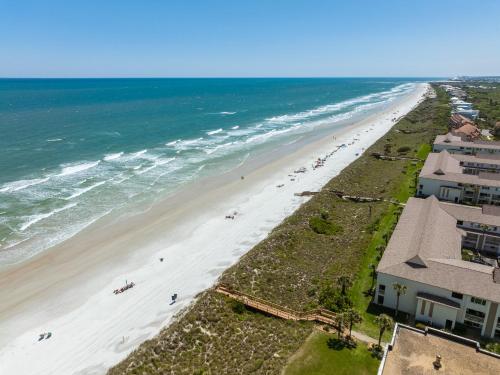 an aerial view of a beach with people on it at Four Winds I-9T in Cedar Landing
