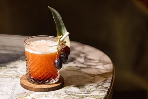 a drink sitting on top of a table at Best Western Plus Le Roi Arthur Hôtel & Spa in Ploërmel