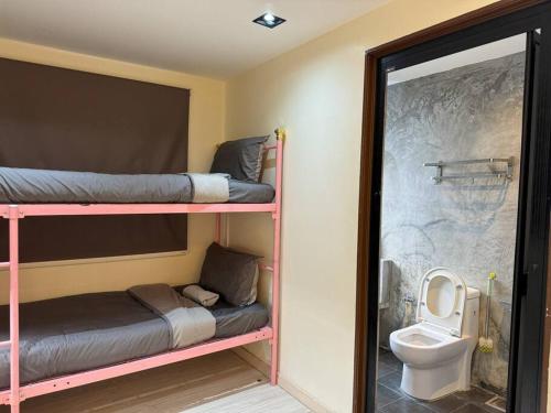 a room with two bunk beds and a toilet at Gathering l Wedding House l 18paxTaman OUG KL in Kuala Lumpur