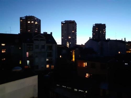 a city skyline with tall buildings at night at Greatly located/parking/balcony/2 bathrooms in Zagreb