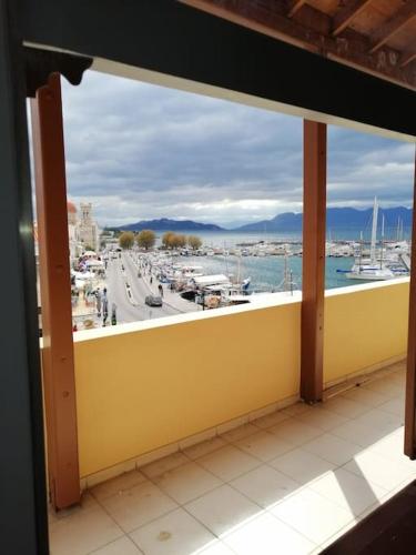 a view of a marina from a balcony at Aegina Port Apt 2-Διαμέρισμα στο λιμάνι της Αίγινας 2 in Aegina Town