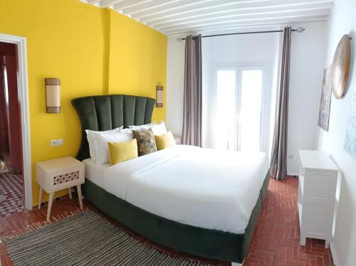 Ένα ή περισσότερα κρεβάτια σε δωμάτιο στο Jack's Apartments & Suites
