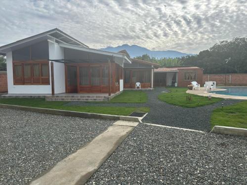 a house with a pool in front of it at Eco Cabañas Montana in Santa Helena