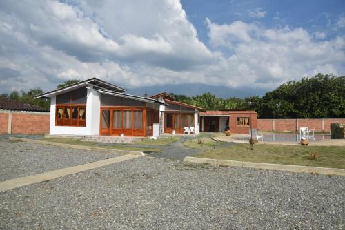 a house with a lot of windows and aphalt at Eco Cabañas Montana in Santa Helena