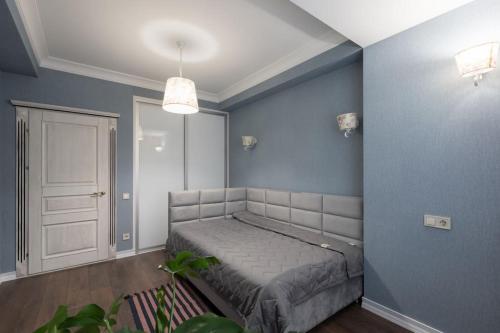 En eller flere senge i et værelse på Flatkeepers - Classic Suite
