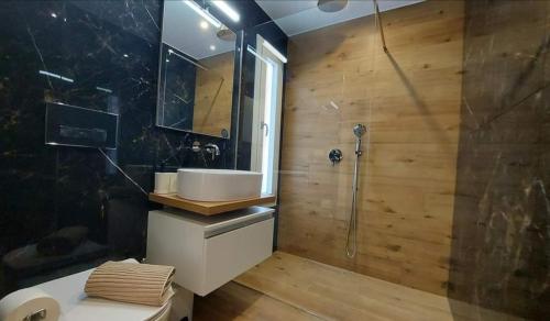 a bathroom with a sink and a shower at VILLA ASTORE in Ruffano