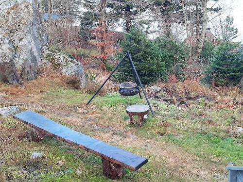 a swing and a bench in a field at 7 person holiday home in SANDNES-By Traum in Forsand