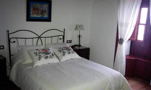 Postel nebo postele na pokoji v ubytování Casa El Faro