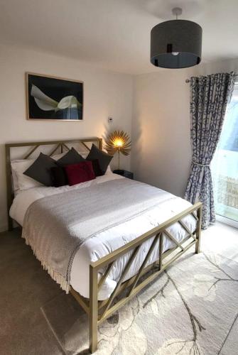 a bedroom with a large bed and a window at Insch House in Kincraig