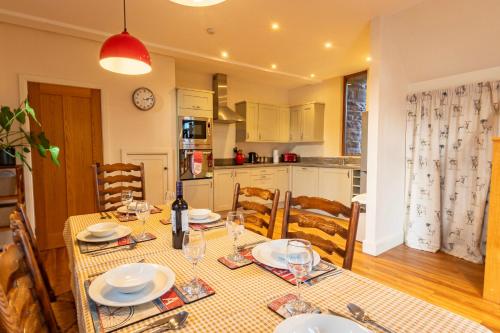 a kitchen and dining room with a table and chairs at Marina View, Near Canal and Mountains in Brecon