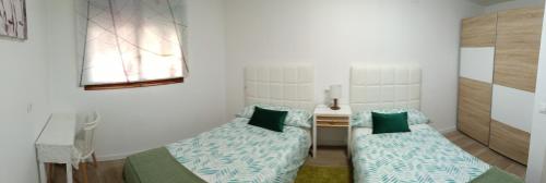 Postel nebo postele na pokoji v ubytování APARTAMENTO ESTEL