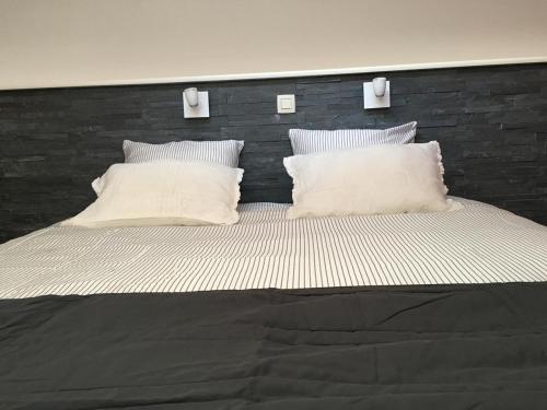 Postel nebo postele na pokoji v ubytování B&B De Kaai