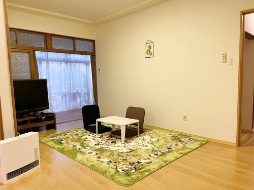 TV a/nebo společenská místnost v ubytování Otami Stay