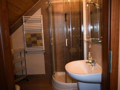a bathroom with a shower and a sink and a toilet at Holiday Home in Natura 2000 with Fishing in Tuczno