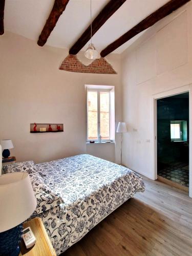 a bedroom with a bed and a window at Casa con terrazza esclusiva vicino al mare Domus Neapolis Happy Holiday in Naples