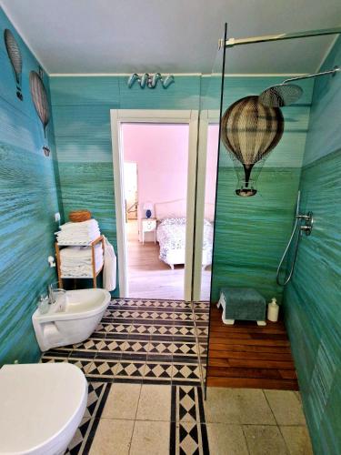 a bathroom with a toilet and a sink and a shower at Casa con terrazza esclusiva vicino al mare Domus Neapolis Happy Holiday in Naples