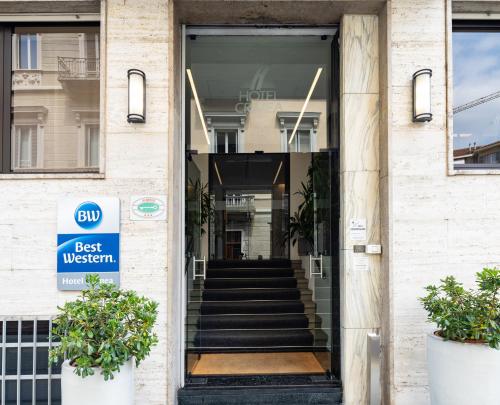 a door to a best western building with stairs at Best Western Hotel Crimea in Turin