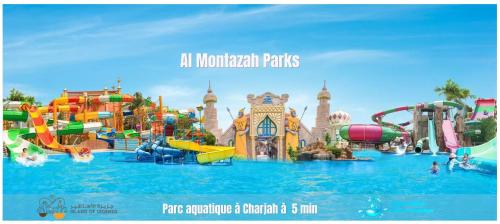 an image of a water park with a water slide at Luxury Appartement Amazing View 130m2 Al Majaz 3 in Sharjah